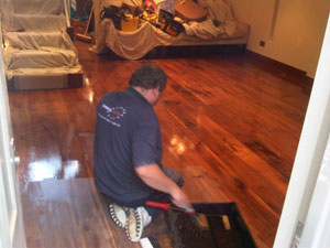 Flooring being stained and polished